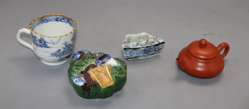 A group of Chinese porcelain including a Redware teapot, a blue and white tea cup and two other pieces